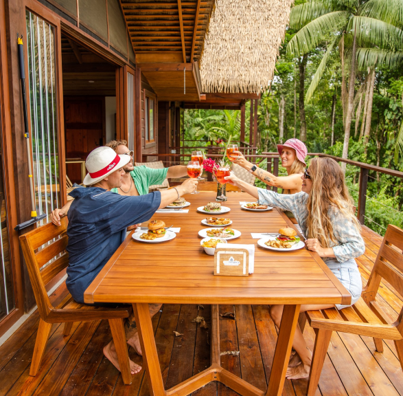 Guests dining on Casa Botanica balcony in Bocas del Toro