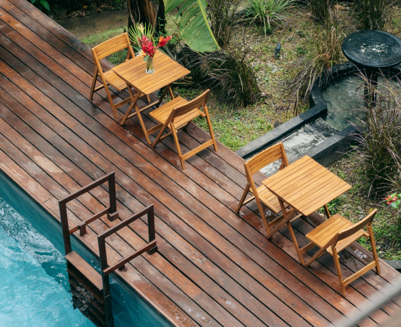 Casa Botanica pool deck with outdoor tables and chairs